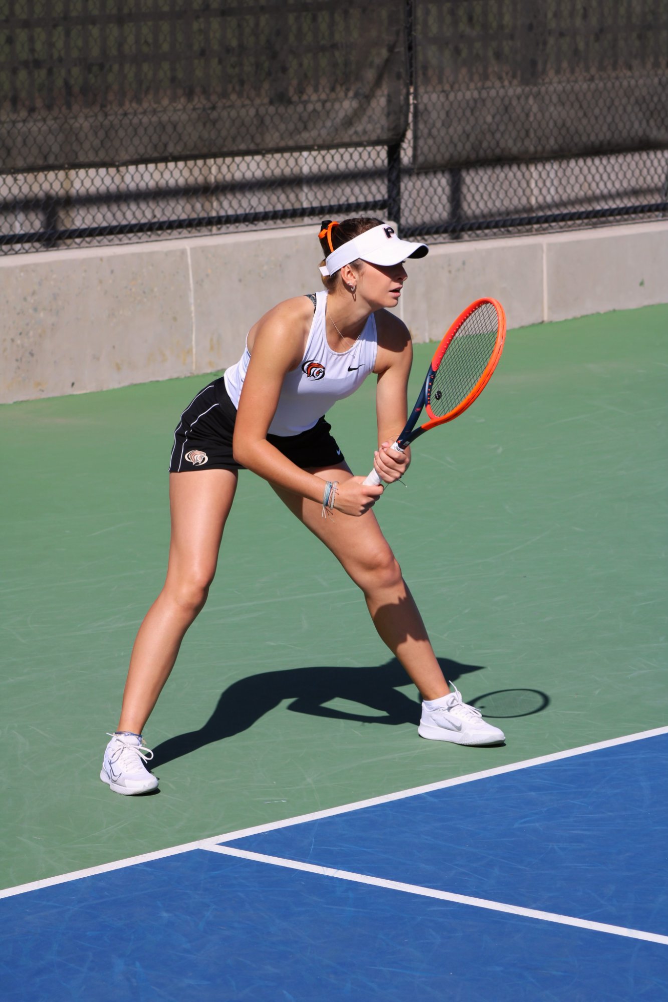 Tomi Main in ready position at University of the Pacific in black and white Tigers uniform