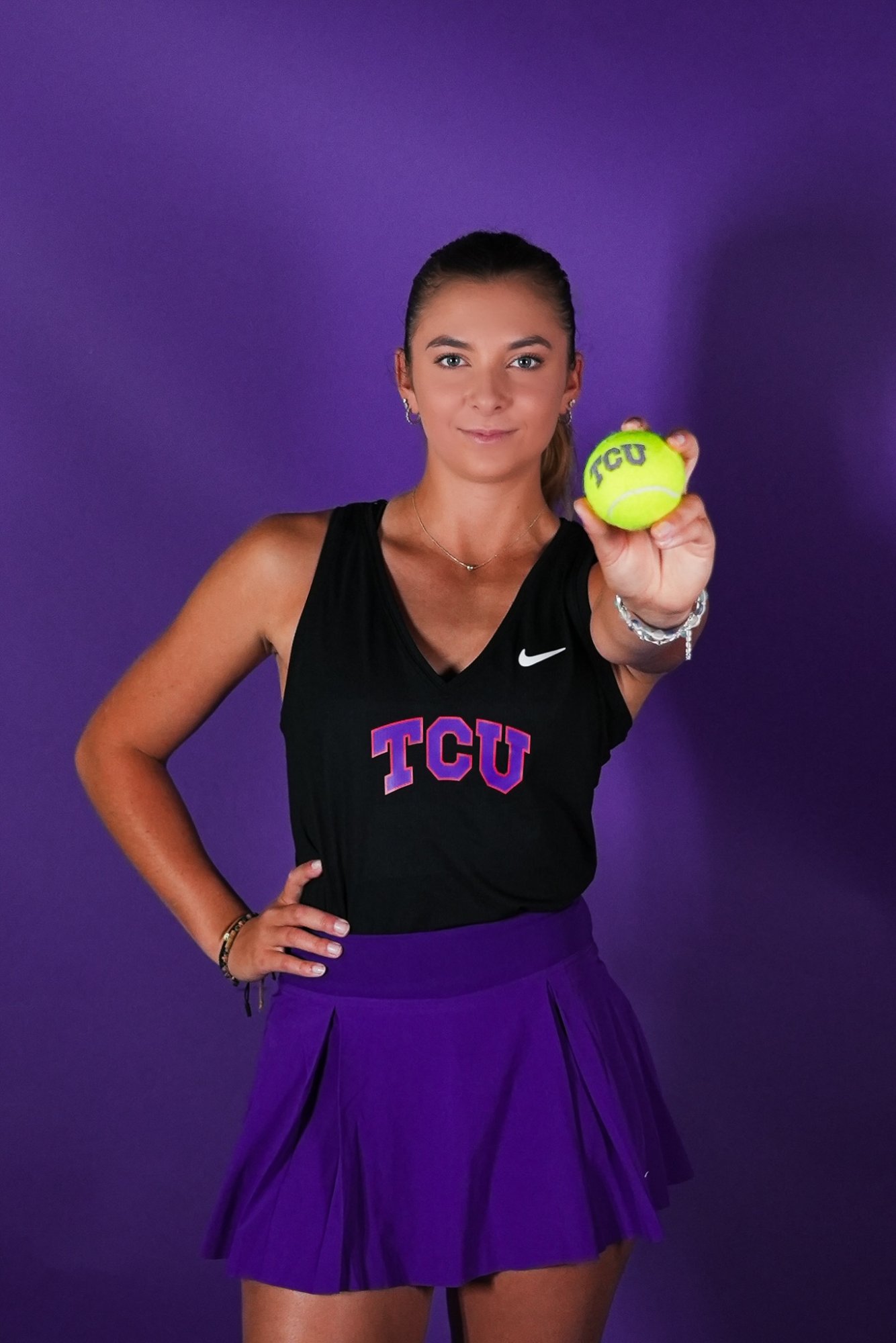 Tomi Main professional portrait in TCU tennis gear